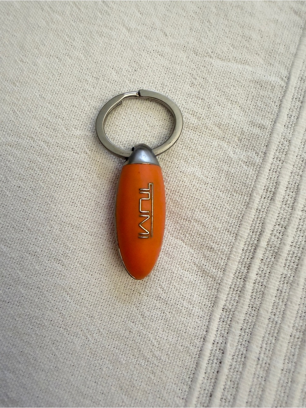 Tumi Orange Oval Logo Key Fob with Metal Ring - Picture 2 of 5